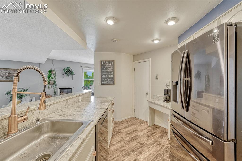 Image 5 of 48: Kitchen with large walk in pantry