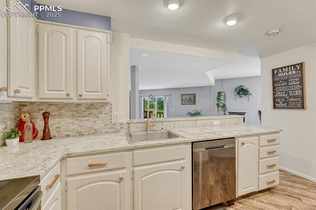 Image 6 of 48: Kitchen looking into living and dining room