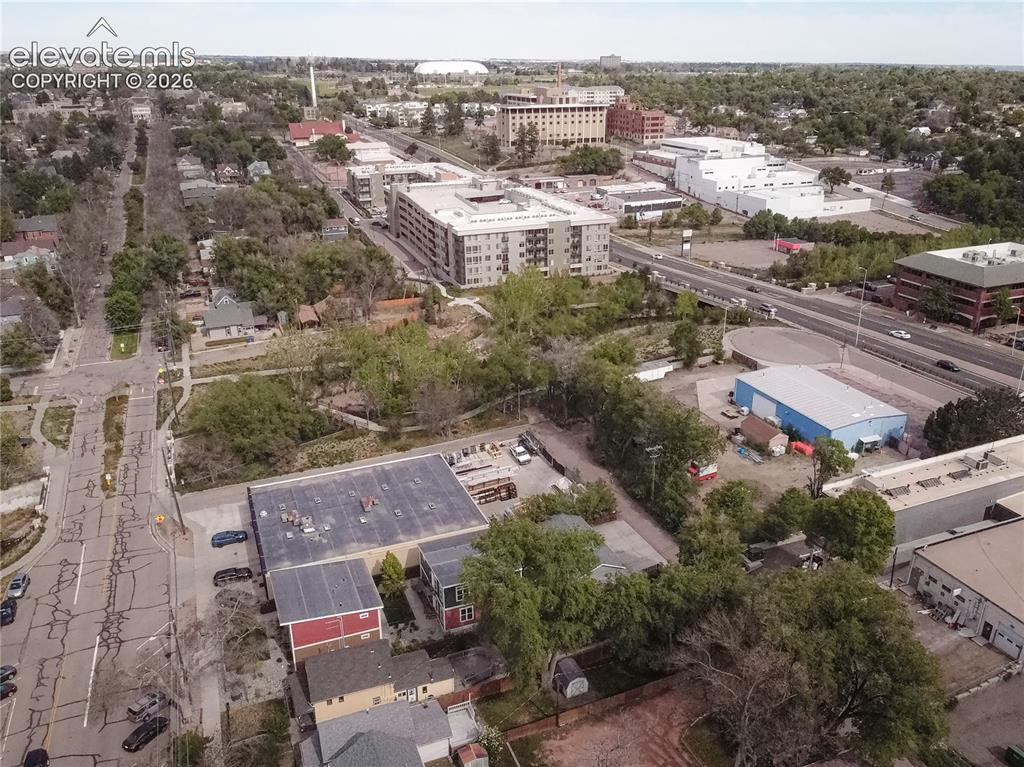 Image 49 of 50: Aerial perspective showcasing a mixed-use urban landscape with commercial a