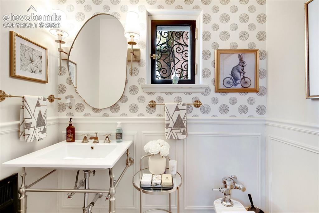 Image 8 of 50: Powder Room by Front Door