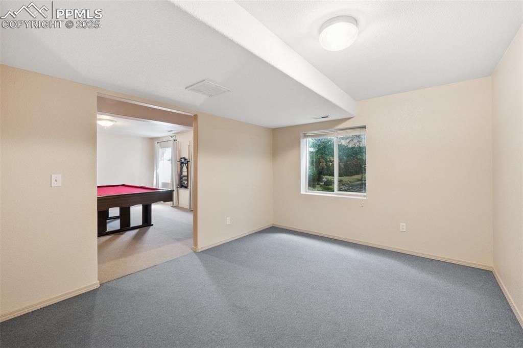 Image 19 of 27: Recreation room featuring light colored carpet and billiards