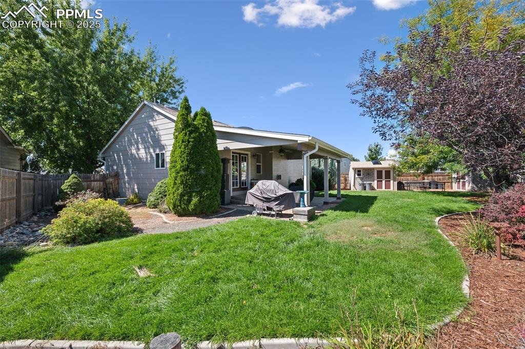 Image 24 of 27: Rear view of house featuring a patio area