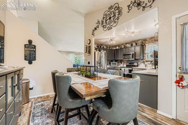 Image 4 of 15: Dining area featuring light wood finished floors and baseboards