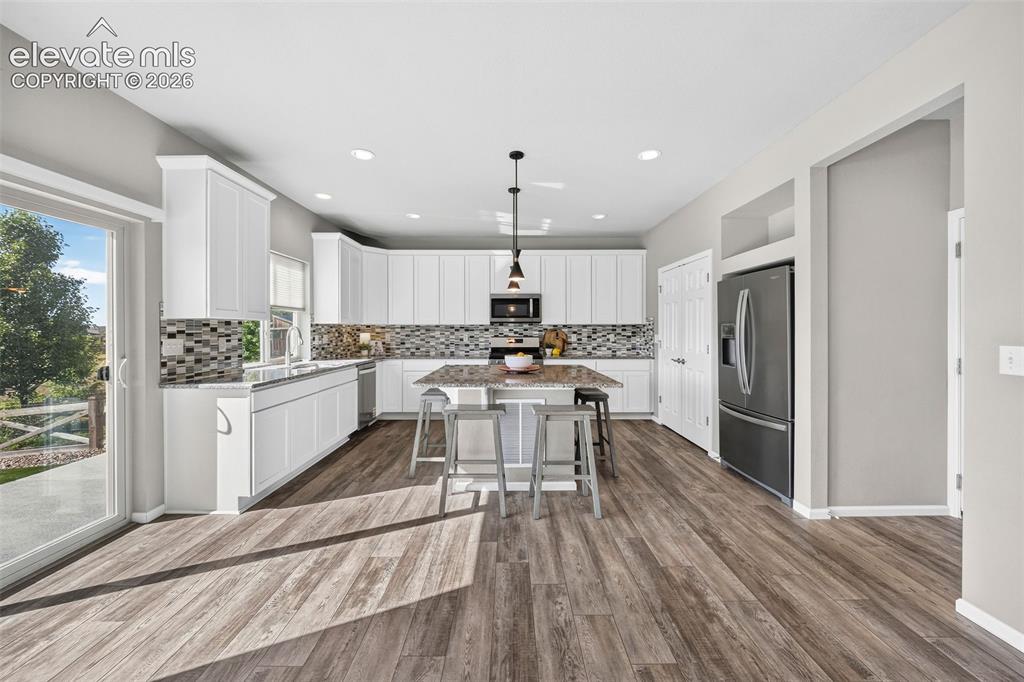 Image 10 of 48: Look how bright and spacious this kitchen is! There is TONS of counter spac