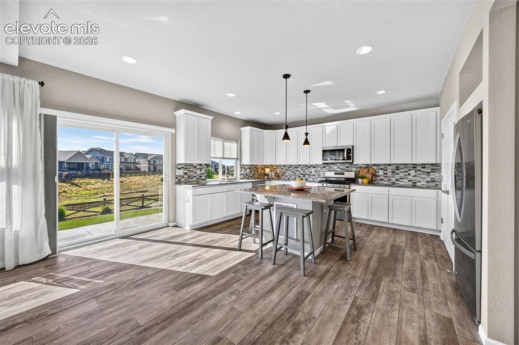 Image 11 of 48: Those views out of the kitchen window and sliding glass doors - you will ne