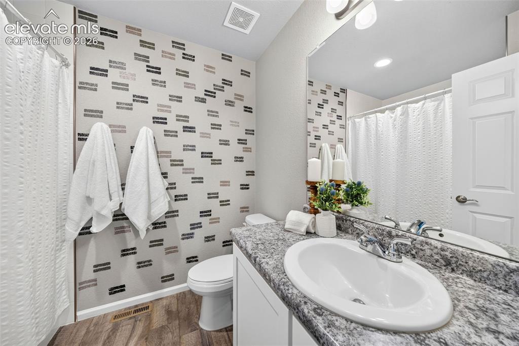 Image 25 of 48: How cute is this second bath upstairs? It services the two other bedrooms o