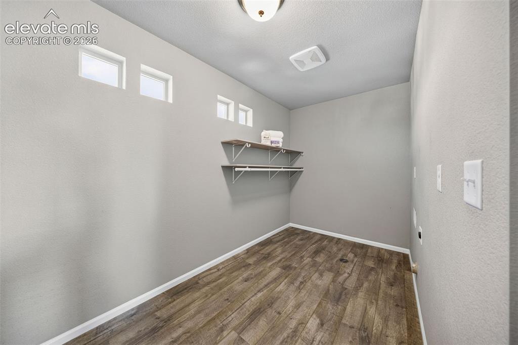 Image 27 of 48: This laundry room is large enough to make you love doing laundry. Yes, I sa
