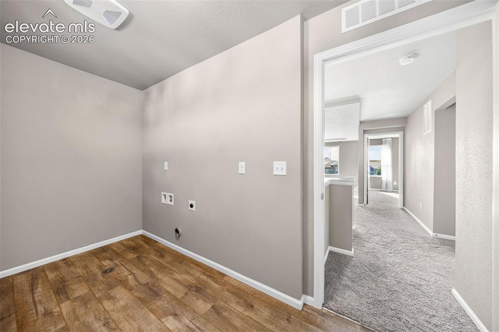 Image 28 of 48: This is a view of the laundry room toward the loft and primary bedroom. Put