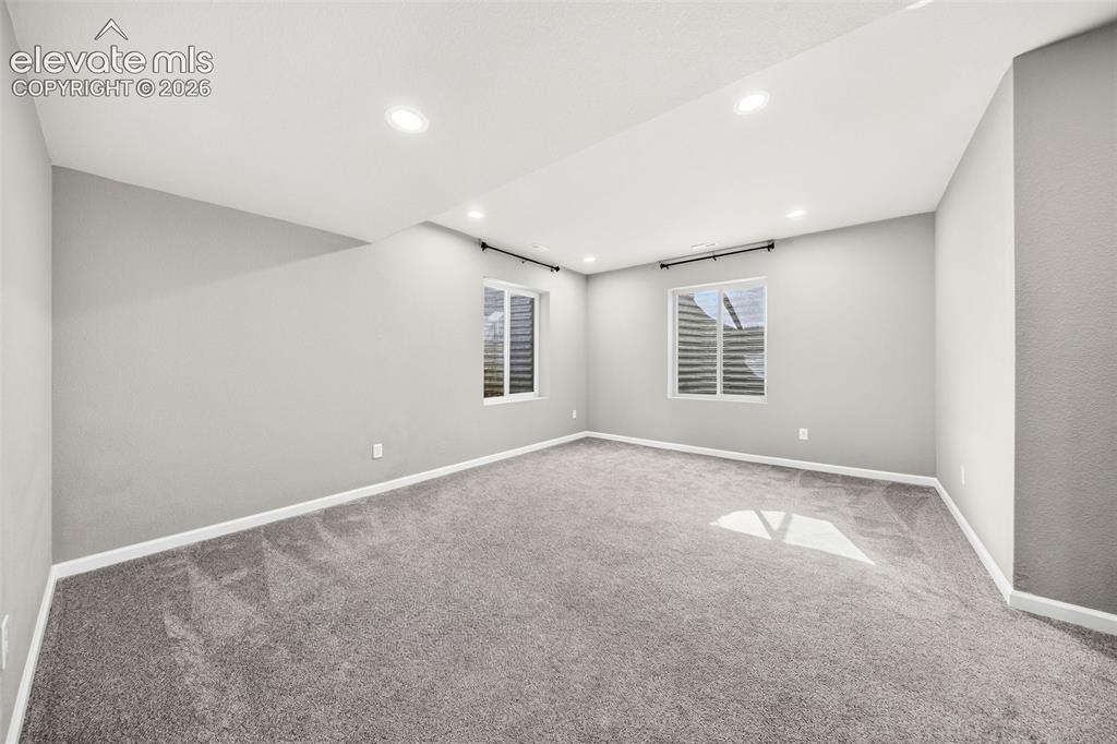Image 29 of 48: This basement family room is yet a THIRD flexible living space in this beau