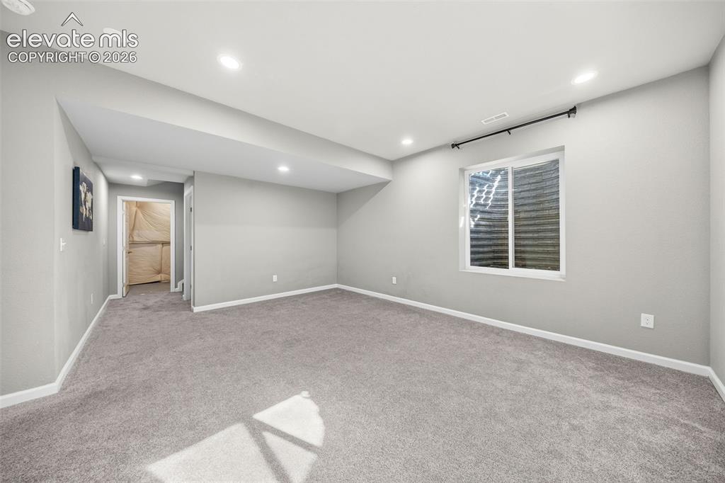 Image 30 of 48: The family room gets plenty of natural light. You won