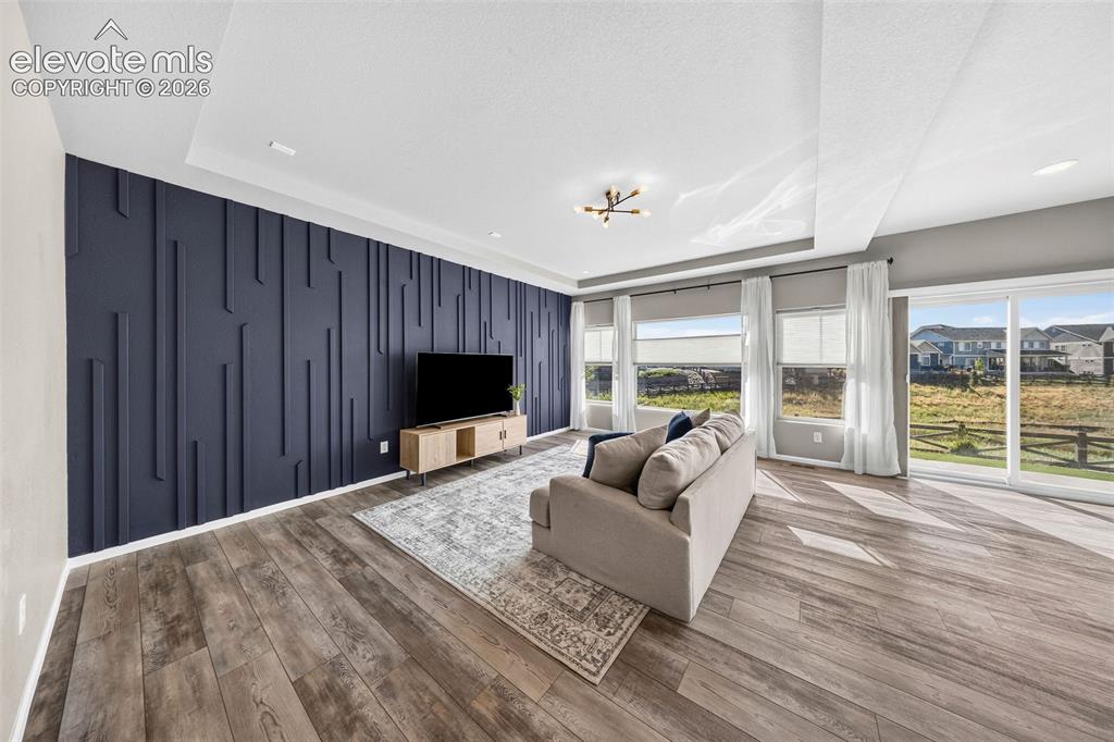 Image 7 of 48: Such a WOW space! The main floor living room has luxury vinyl plank floorin