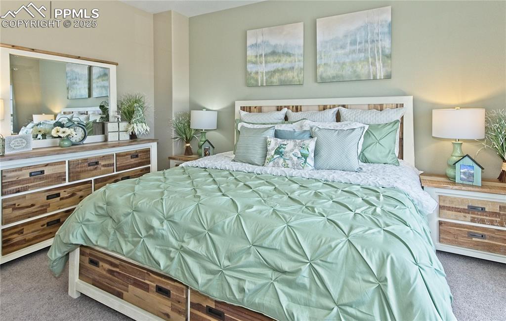 Image 21 of 30: Bedroom with carpet flooring