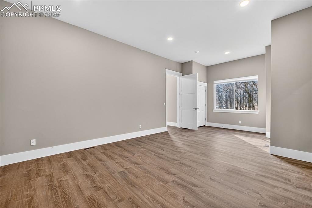 Image 16 of 50: Spare room featuring light wood finished floors and recessed lighting