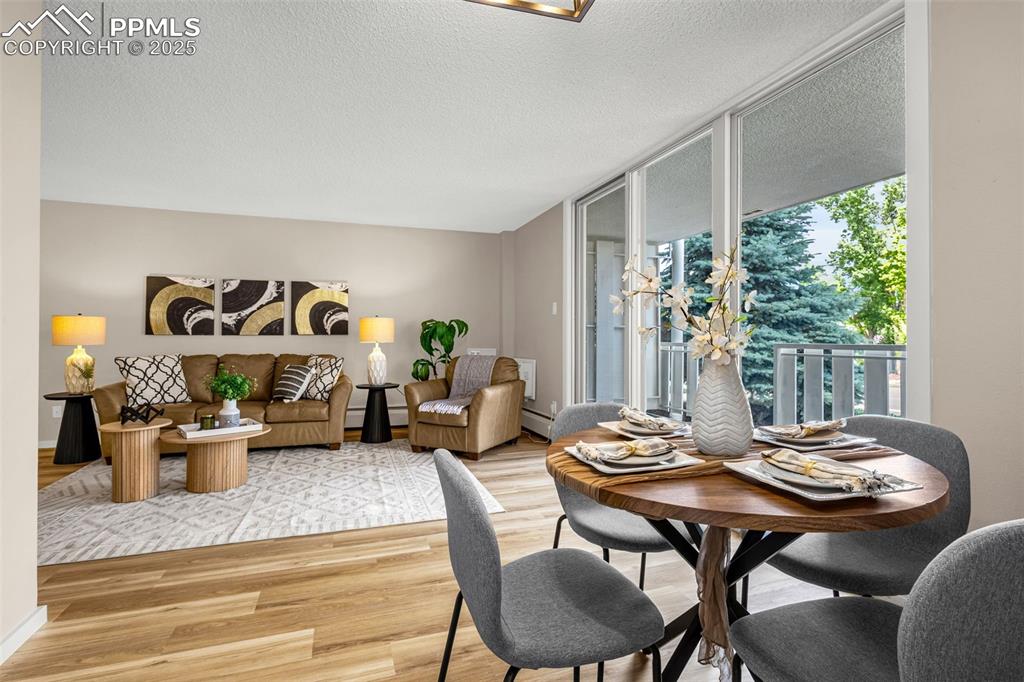 Image 3 of 14: Living/Dining Area walks out to HUGE patio!