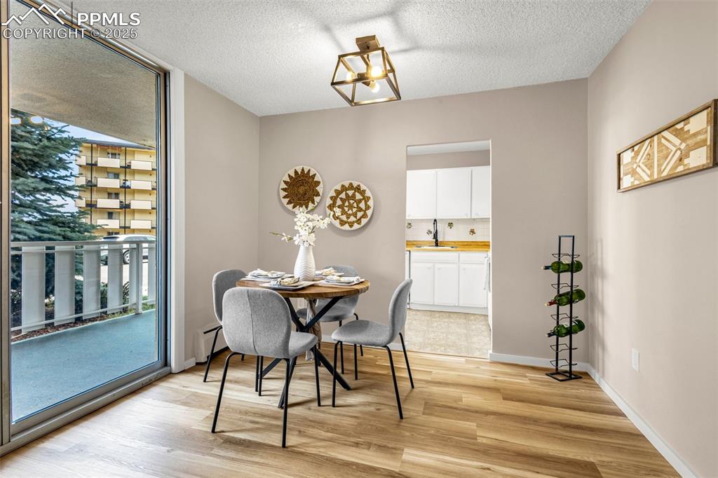 Image 4 of 14: Dining area with new light fixtures