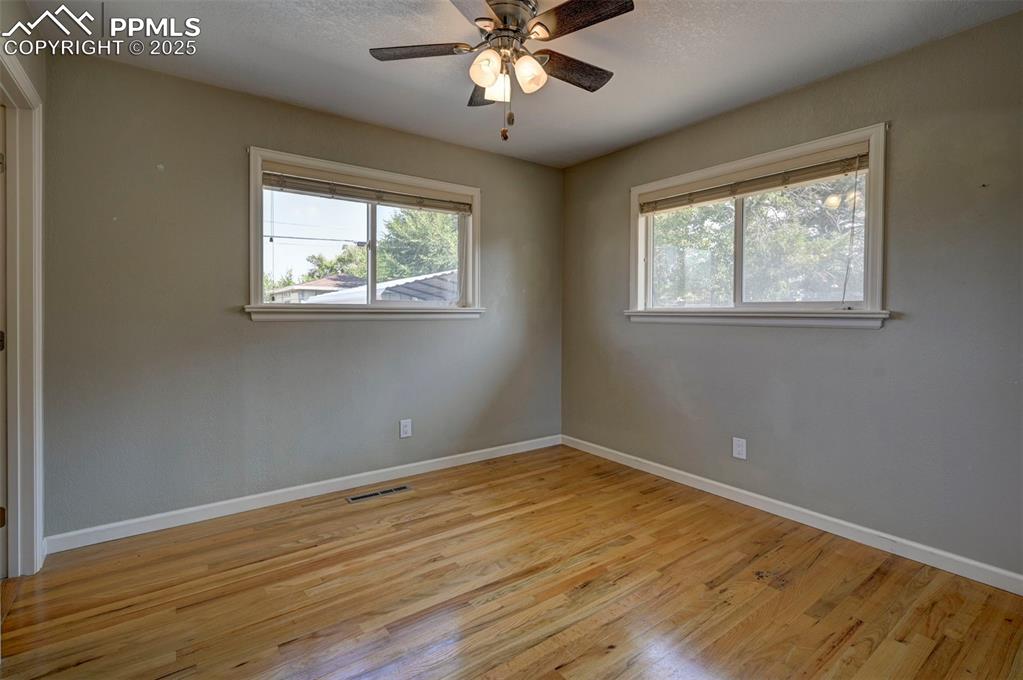 Image 17 of 33: Spare room featuring light wood finished floors, healthy amount of natural 