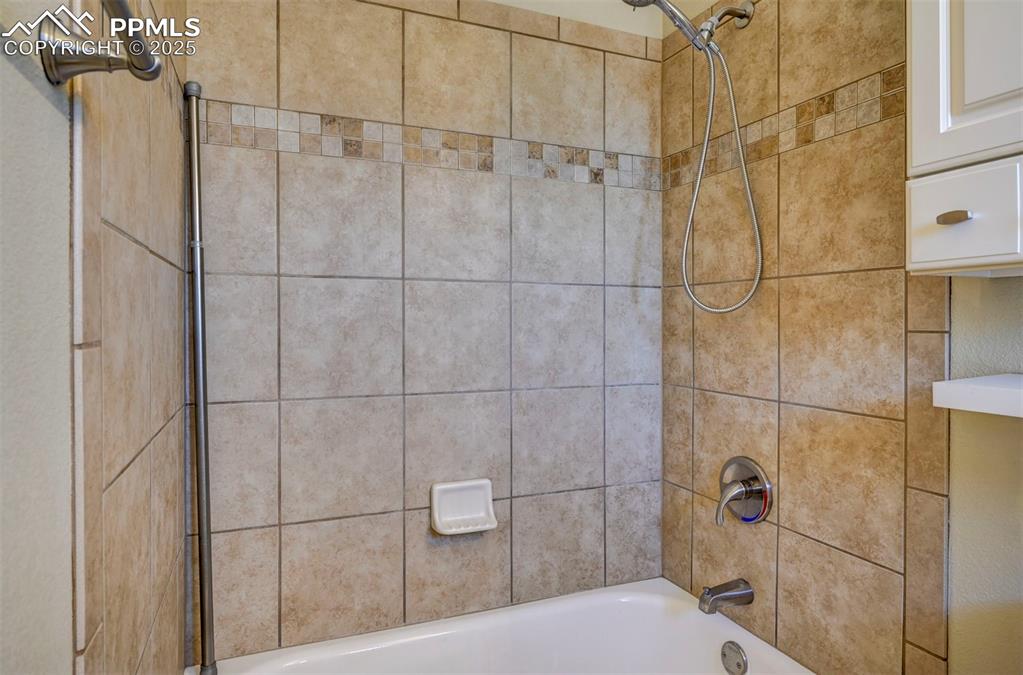 Image 20 of 33: Full bathroom featuring shower / bathtub combination