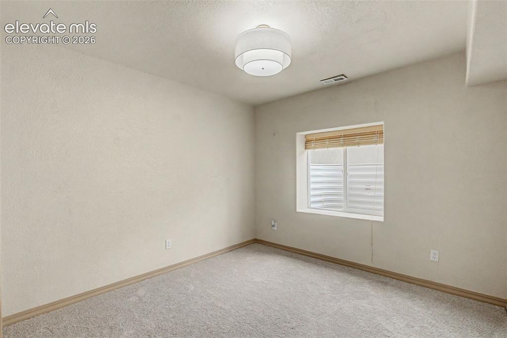 Image 23 of 40: full bathroom attached to the lower level bedroom