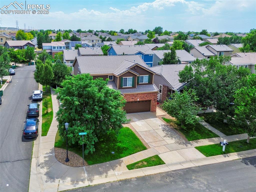 Image 2 of 29: Craftsman-style house with a garage, brick siding, concrete driveway, and a