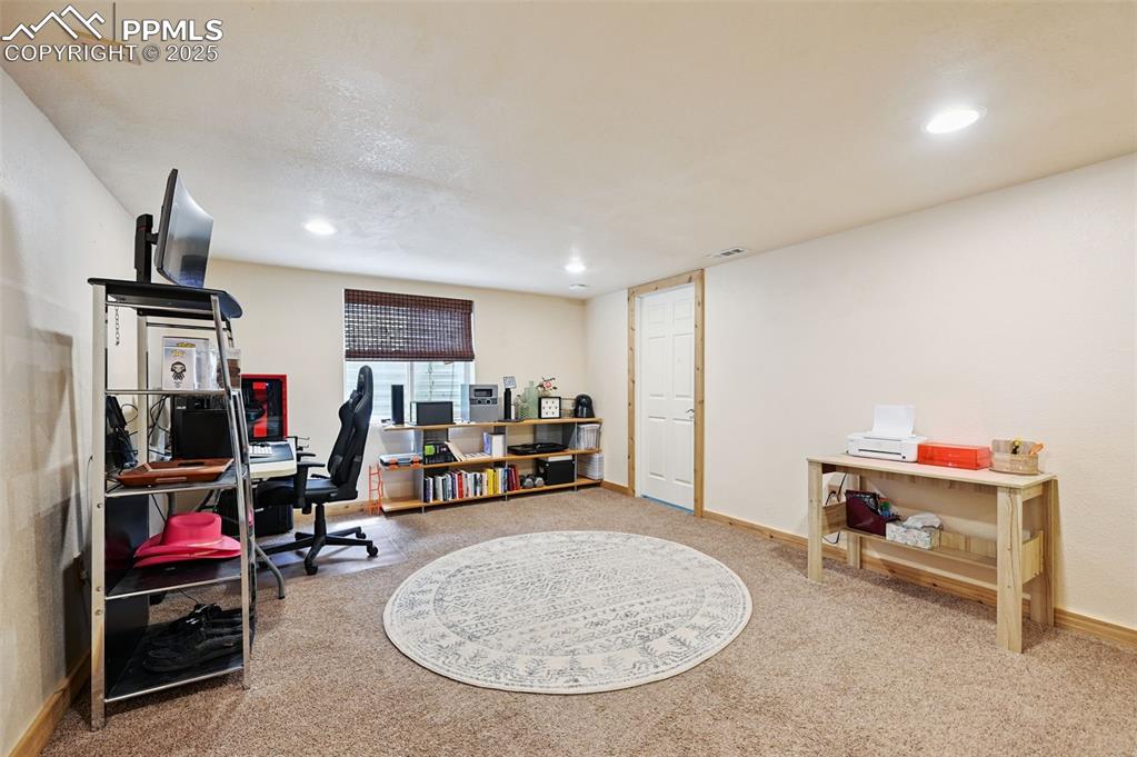 Image 25 of 29: Office with carpet flooring and recessed lighting