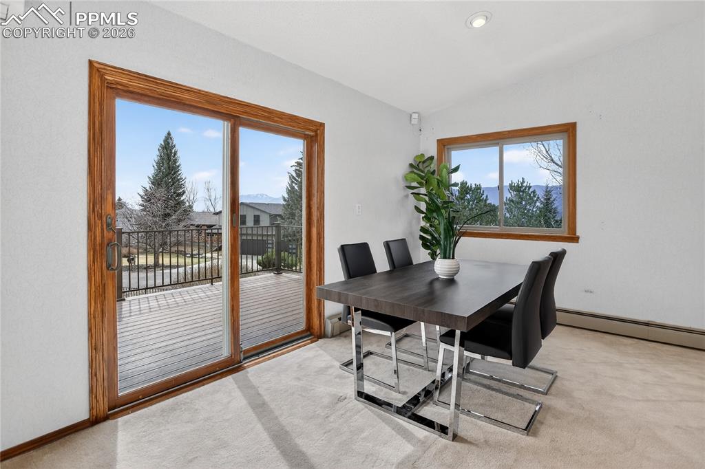 Image 4 of 30: Dining area w/ walk-out to deck