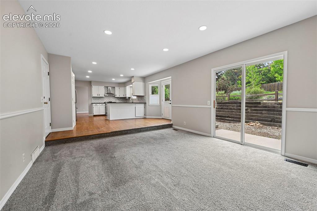 Image 12 of 50: Family Room looking into the Kitchen