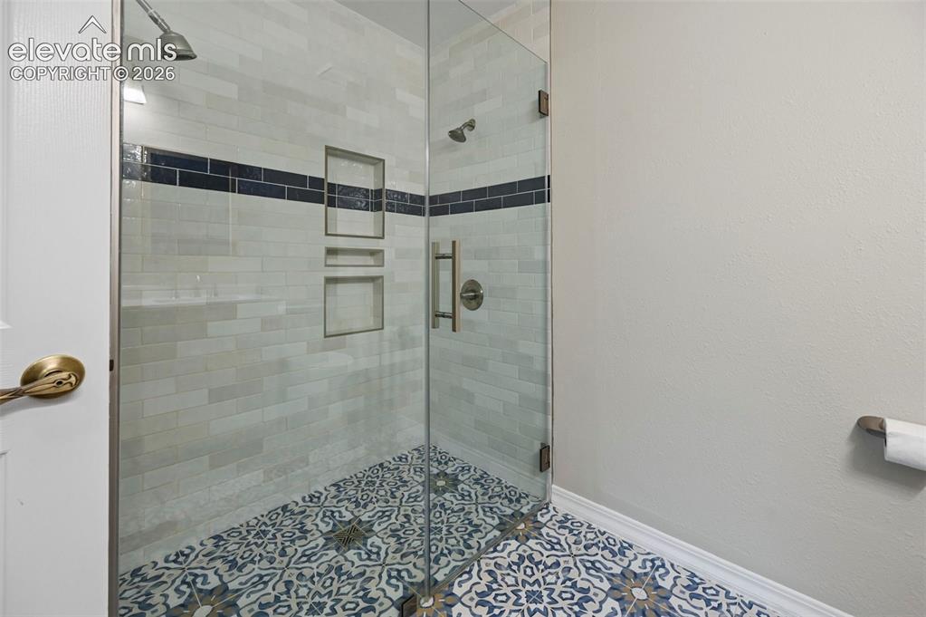 Image 29 of 50: Shower in Upstairs Bathroom