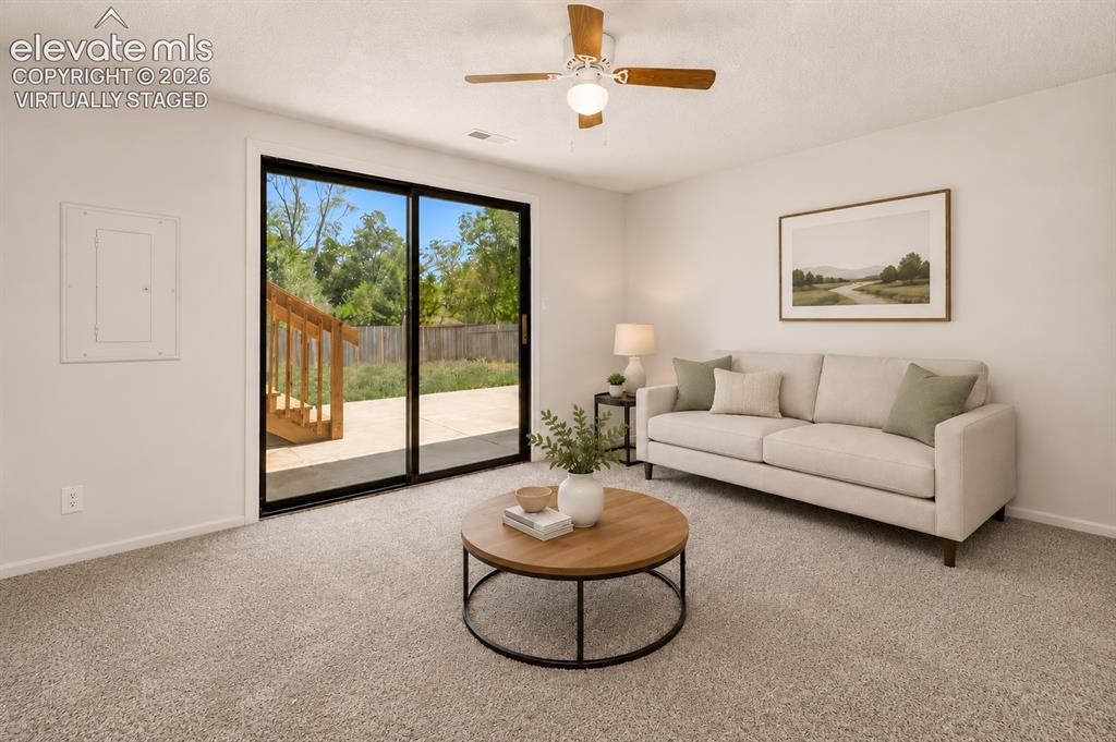 Image 20 of 31: Family Room with a Walk-out to a Beautiful New Deck & a Patio - Virtually S