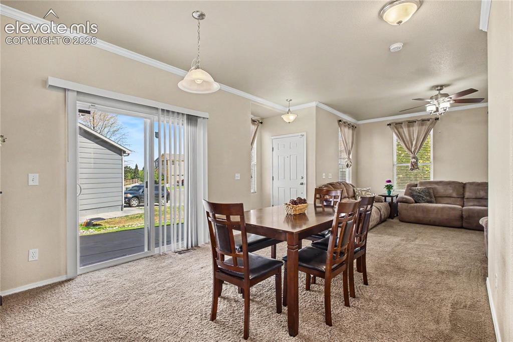 Image 12 of 41: Dining area with crown molding