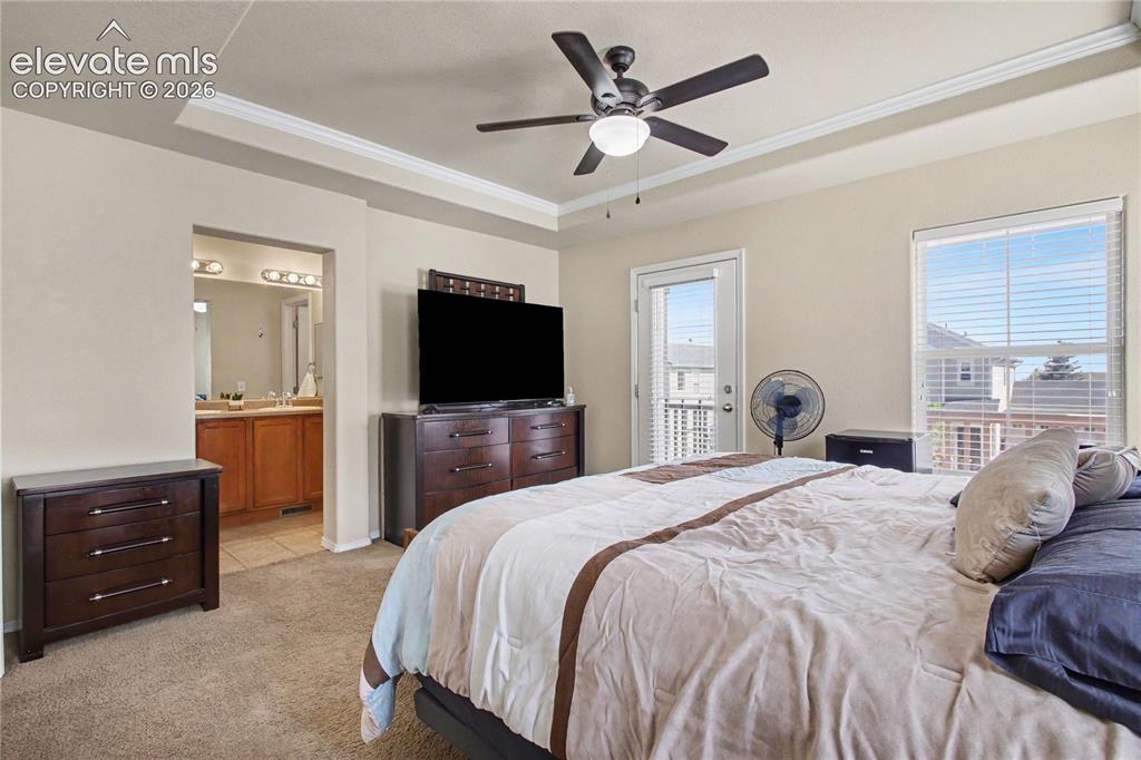 Image 18 of 41: Primary bedroom with en-suite bathroom