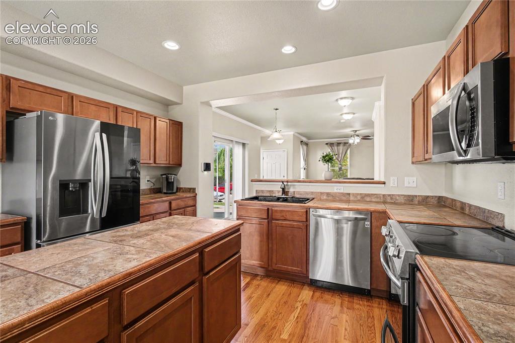 Image 2 of 41: Kitchen with maple cabinets