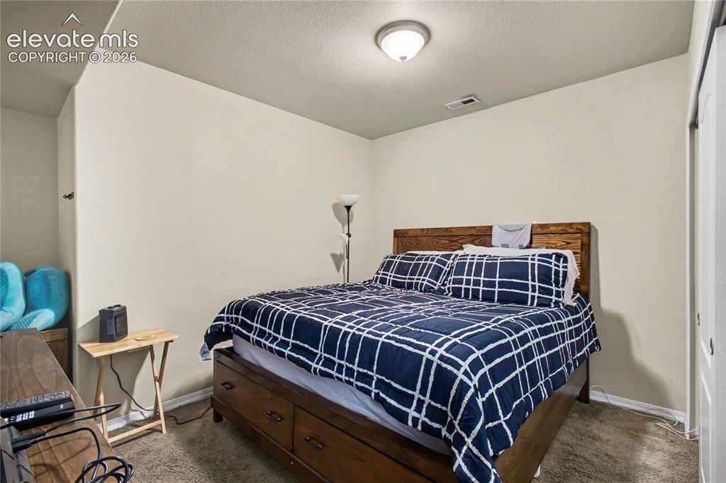 Image 21 of 41: Bedroom with double door closet