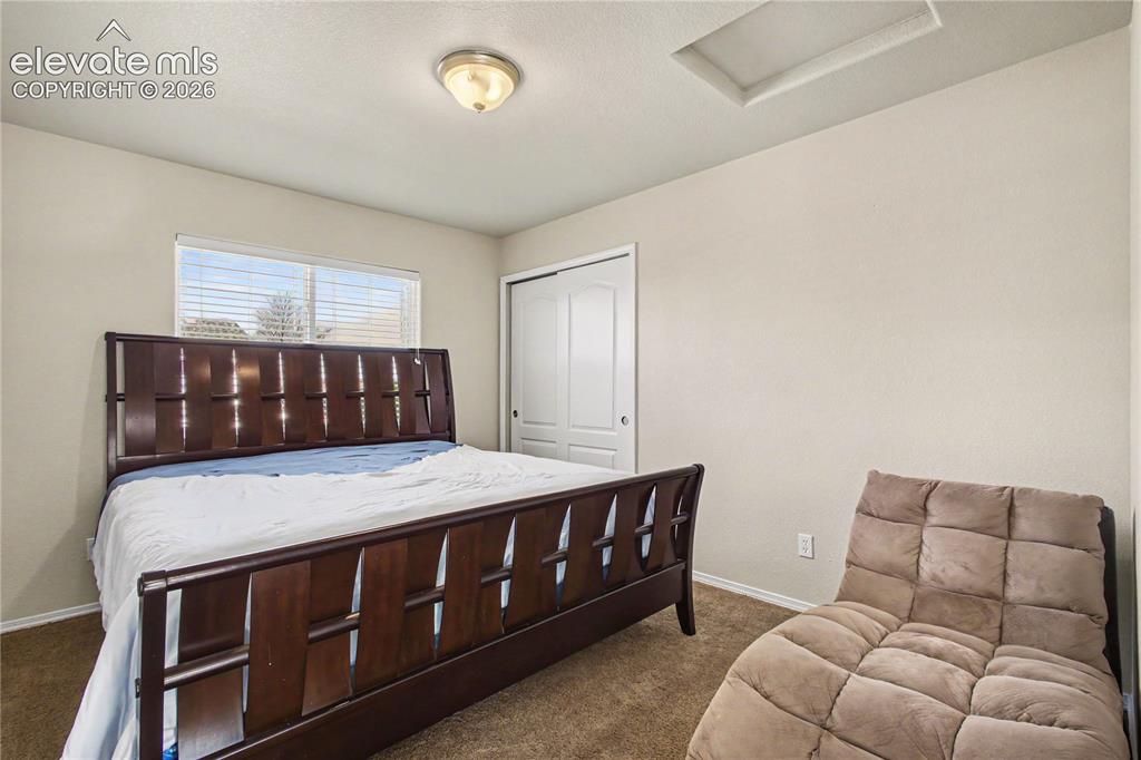 Image 23 of 41: Bedroom with double door closet