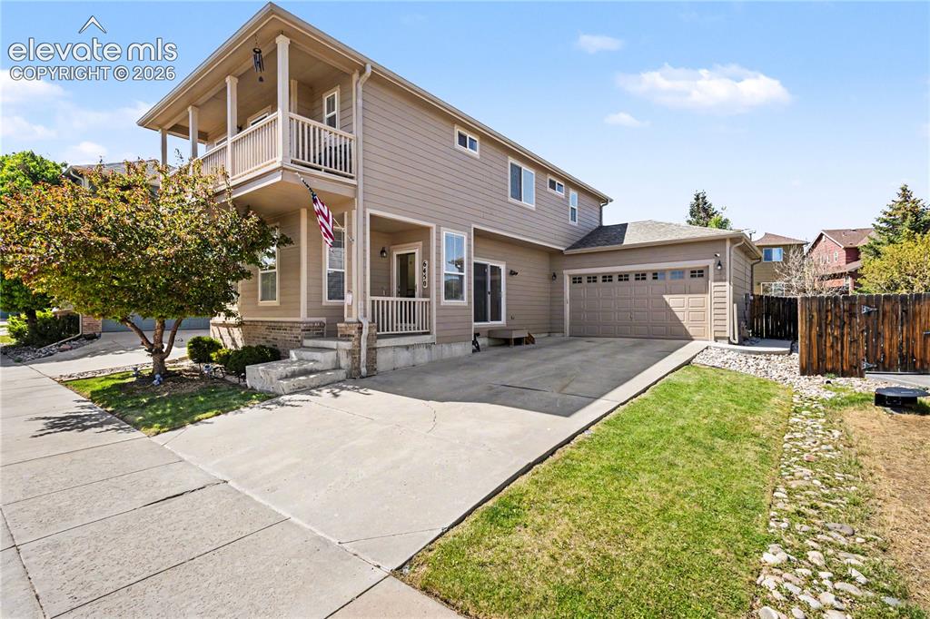 Image 4 of 41: Exterior Front with extra long driveway