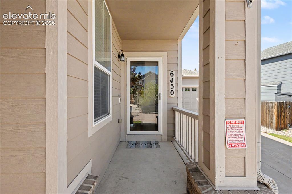 Image 7 of 41: Covered front porch
