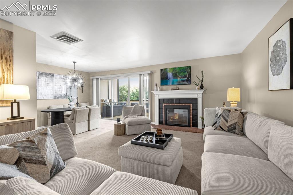 Image 2 of 24: Spacious living room and dining room with walkout to huge balcony!
