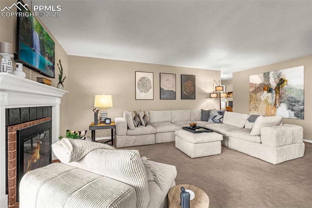 Image 6 of 24: Elegant living room and hall to bedrooms