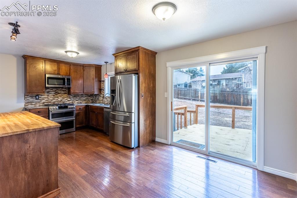 Image 10 of 20: Dining Room and Kitchen Area