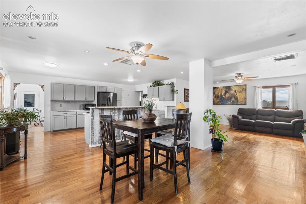 Image 4 of 41: This is the view from the front door. Gorgeous hard wood floors, open floor