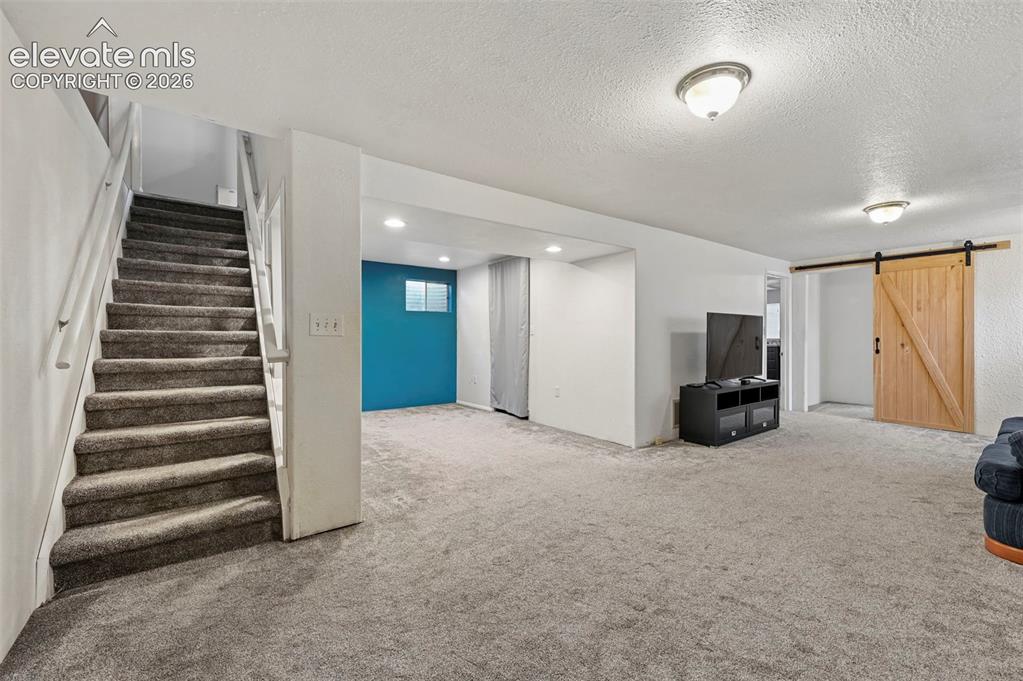 Image 19 of 33: Basement area with Bonus Room