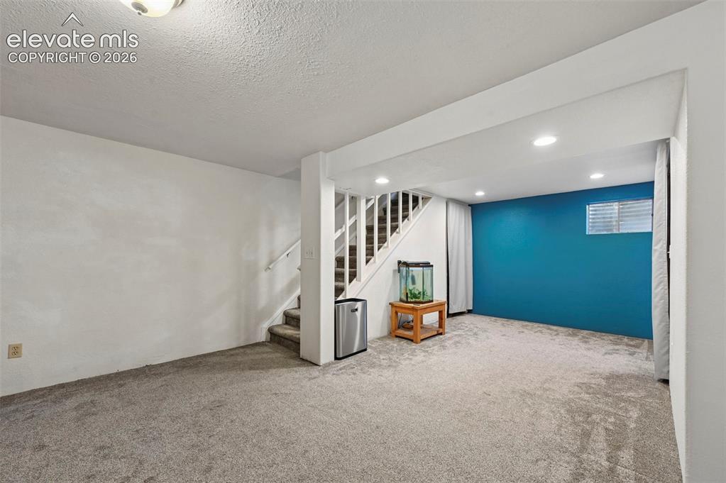 Image 20 of 33: bonus area in Basement.  Storage underneath stairs.  