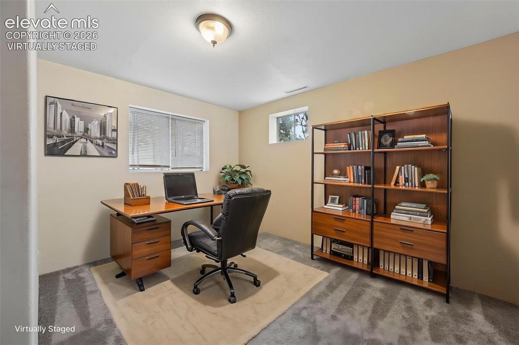 Image 23 of 33: Virtually staged 4th bedroom in basement