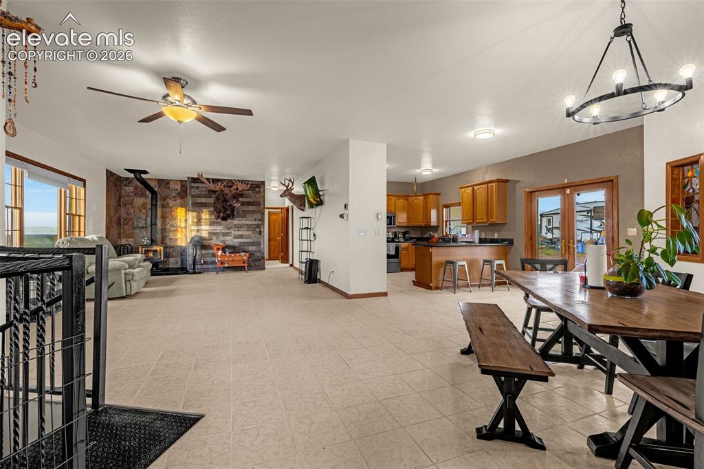 Image 11 of 50: Spacious open-concept interior featuring light-toned flooring