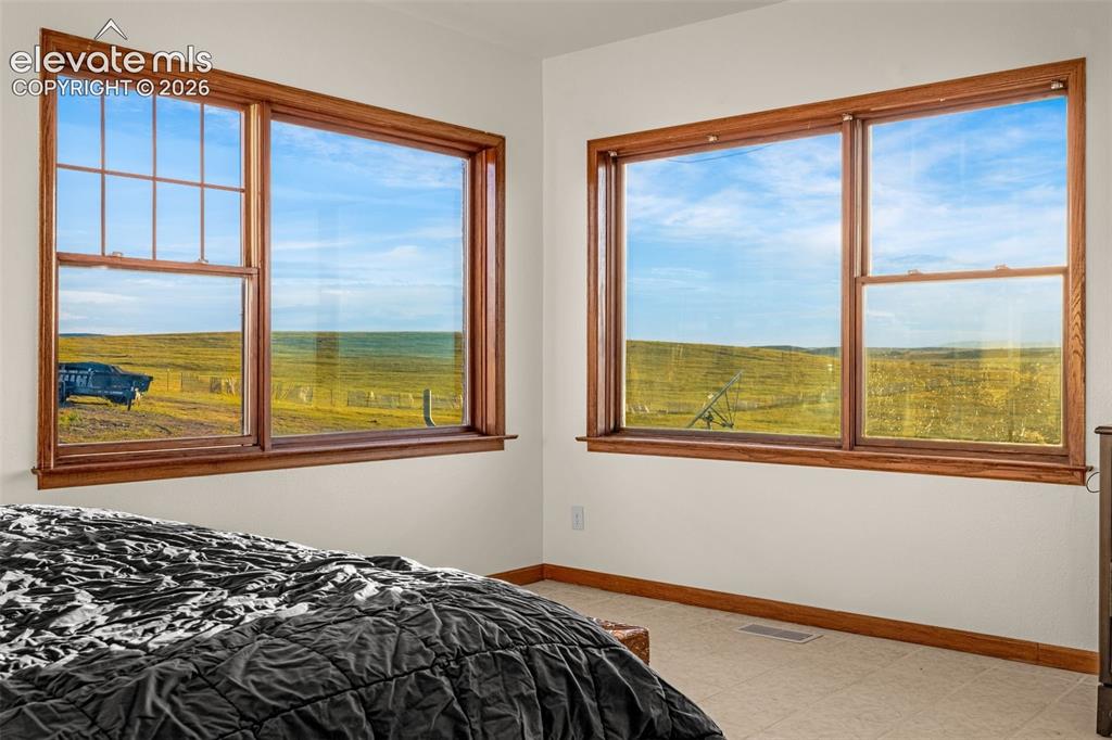 Image 19 of 50: Dual windows with wood-finish trim and sills