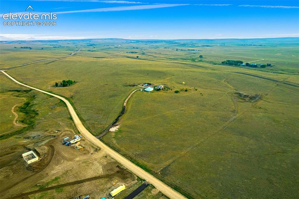 Image 50 of 50: Expansive acreage featuring rolling terrain, vast open grasslands, gravel r