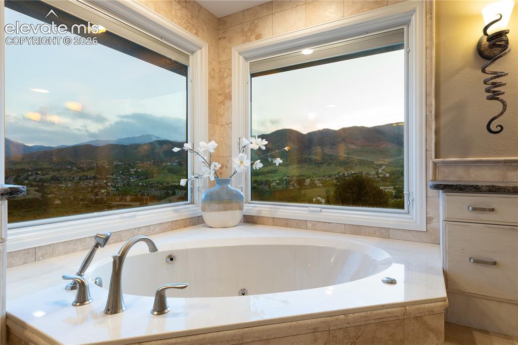 Image 30 of 50: Enjoy Evening Views of Pikes Peak from the Jetted Soaking Tub!