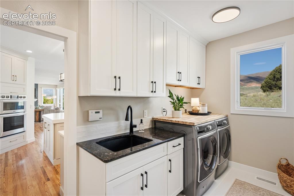 Image 45 of 50: Main Level Laundry Room!