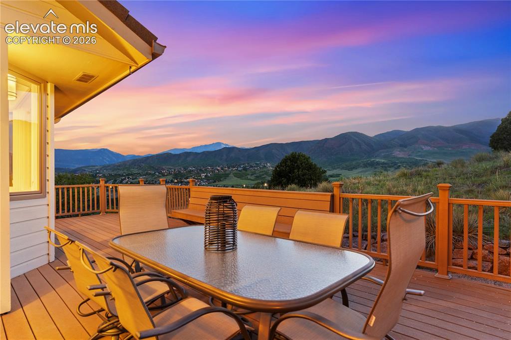 Image 8 of 50: Spacious Back Deck Perfect for Entertaining or Enjoying a Quiet Colorado Ev