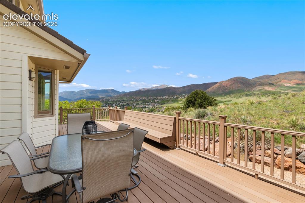 Image 9 of 50: Spacious Back Deck Perfect for Entertaining or Simply Enjoying the Awe-Insp