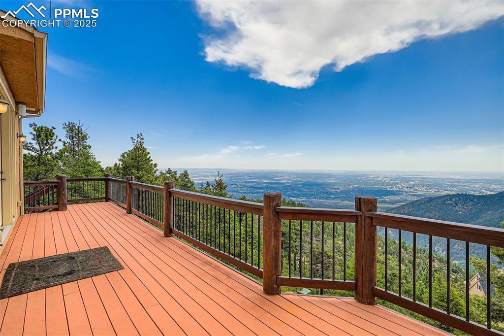 Image 25 of 27: Expansive views of Colorado Springs and the Plains from the deck